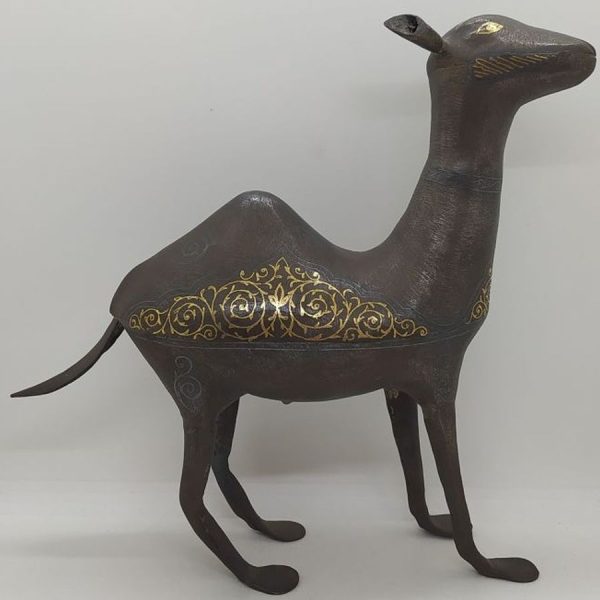 An antique Safavid iron Camel with 24 carat gold inlaid designs made in middle East during the 16th century. Dimension 28 cm X 10 cm X 20 cm.