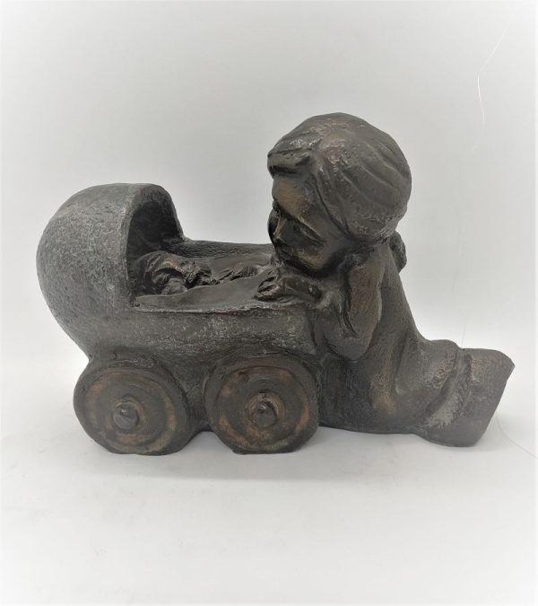 Bronze Statue Baby Carriage led by baby's older sister as common in orthodox big families, older brother and sisters help in daily duties.