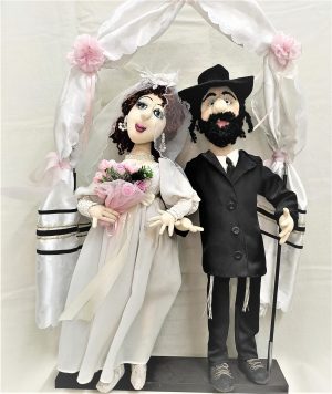 Handmade different fabrics Handmade Doll Jewish Wedding ceremony with a couple of orthodox man and woman under the canopy. Made by Irena.