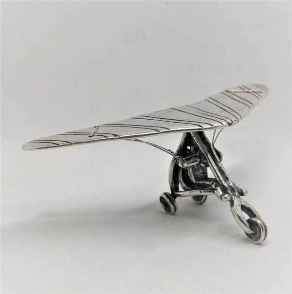 A handmade Sterling silver miniature glider airplane statue. Miniature sterling silver sculptures wide range of original designs.