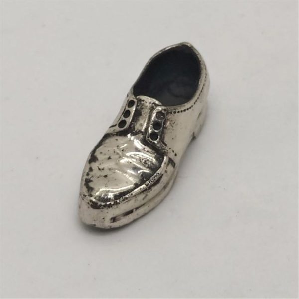 Handmade sterling Silver miniature shoe statue. I have in stock many music instrument like violin , guitar, saxophone and many more.