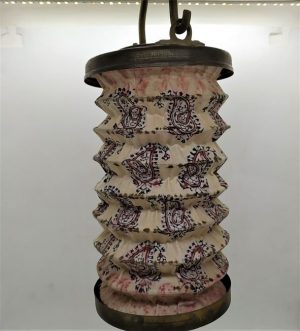 Handmade Vintage brass hanging lantern cut out and hand hammered designs made in the middle East early 20th century with hand painted cloth.