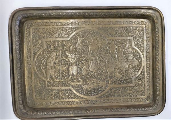 Handmade Vintage brass rectangular tray with hand hammered floral designs and the daily nomads life. Women preparing a barbeque.