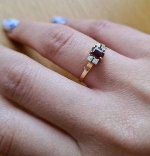 Handmade 14 carat Gold Ring Diamonds Ruby faceted Emerald cut. The four diamonds weigh 8 pts VVs clarity. European finger size 56.