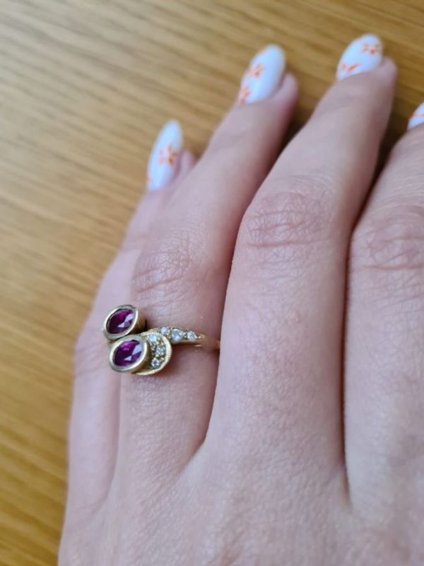 Gold Ring Rubies Diamonds handmade. There are two genuine oval faceted 1.01 carat rubies and twelve white diamonds 17 pts VVS clarity.