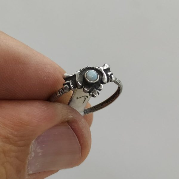 A fine small sterling silver ring white Pearl set incenter suitable for young girls. Dimension 0.6 cm X 1.6 cm approximately.