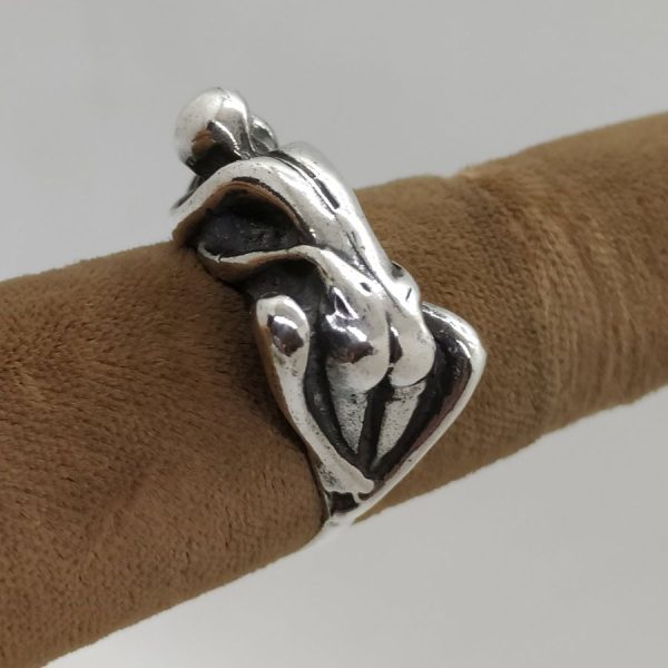 A man & woman making love  couple making love ring is solid heavy silver . The finger USA size is 7.5, European finger size 55.