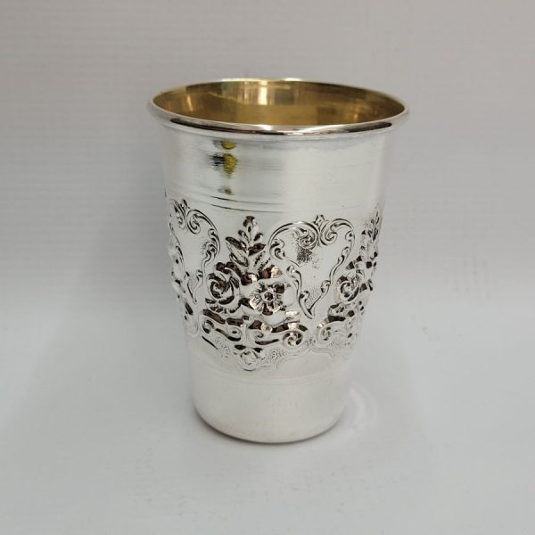 Sterling silver Kiddush cup flowers with roses and Lilly flowers pressed around cup contemporary style. Dimension diameter 7.1 cm X 8,5 cm approximately.