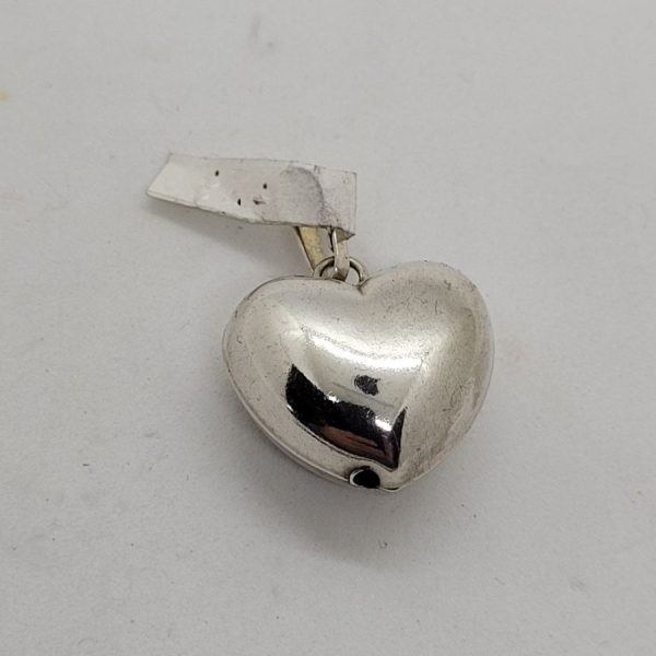 Handmade sterling silver small heart three dimension pendant smooth silver. Proper gift for Valentine day. Dimension 1.2  cm X 2.9 cm X 1 cm approximately.