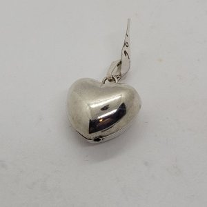 Handmade sterling silver small heart three dimension pendant smooth silver. Proper gift for Valentine day. Dimension 1.2  cm X 2.9 cm X 1 cm approximately.