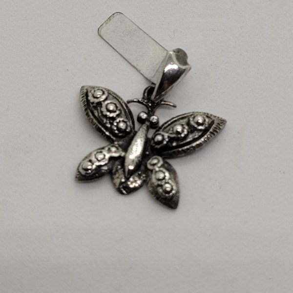 Handmade butterfly sterling silver pendant three  dimension forming a butterfly. Dimension butterfly 2.3 cm X 2.3 cm X 0.3 cm approximately.