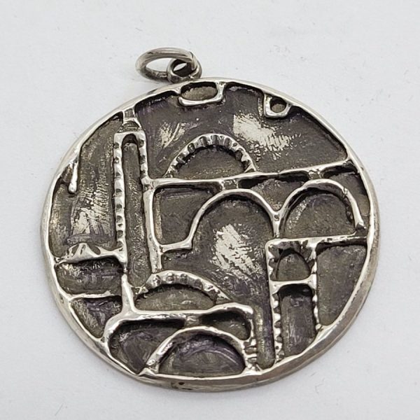 Handmade sterling silver  Jerusalem houses round pendant made by S. Ghatan. Dimension diameter 3.6 cm X 0.25 cm approximately.