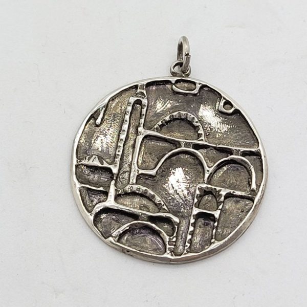 Handmade sterling silver  Jerusalem houses round pendant made by S. Ghatan. Dimension diameter 3.6 cm X 0.25 cm approximately.