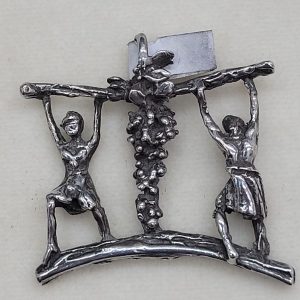 Handmade sterling silver Joshua and Caleb pendant carrying the grapes while spying the Holy Land made by S. Ghatan, 3.4 cm X 3.2 cm X 0.5 cm approximately.