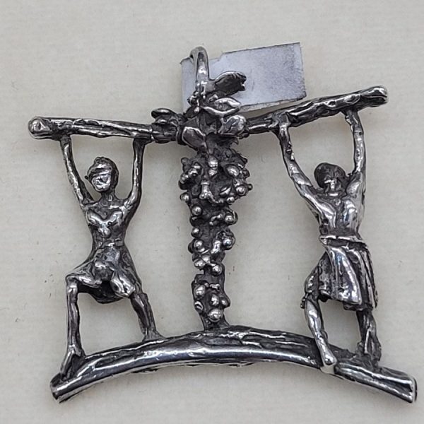 Handmade sterling silver Joshua and Caleb pendant carrying the grapes while spying the Holy Land made by S. Ghatan, 3.4 cm X 3.2 cm X 0.5 cm approximately.
