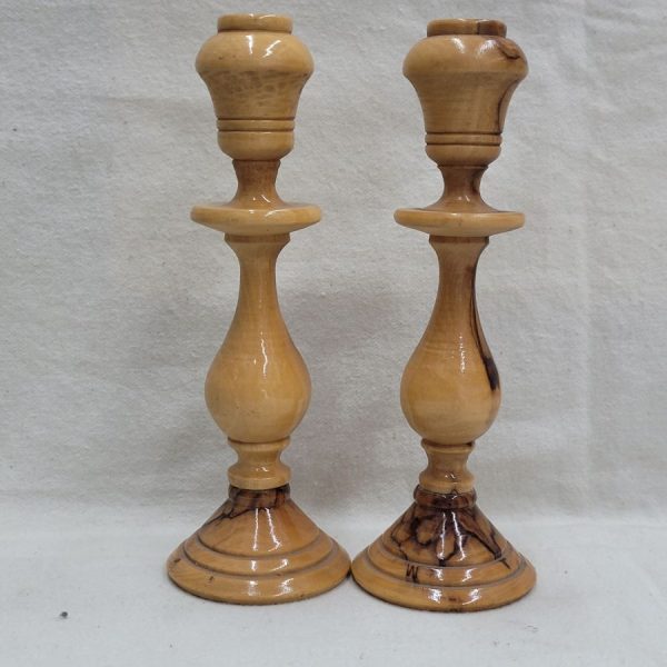 Handmade natural olive wood Sabbath candlesticks, where one can see the olive  wood deigns made by age of wood diameter 5.6 cm X 16 cm approximately.