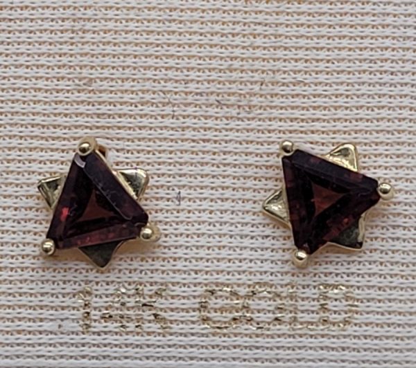 Handmade 14 carat gold MagenDavid stud earrings Garnets set with triangle faceted Garnets to form a star of David design . Dimension 0.7 cm X 0.7 cm approximately.