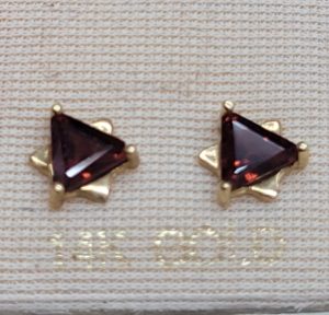 Handmade 14 carat gold MagenDavid stud earrings Garnets set with triangle faceted Garnets to form a star of David design . Dimension 0.7 cm X 0.7 cm approximately.