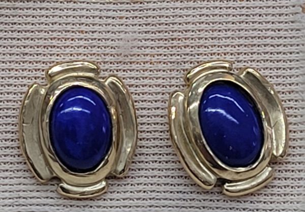 Handmade 14 carat gold stud earrings Lapis Lazuli stones set with oval cabochon Lapis Lazuli stones.   Dimension 0.7 cm X 0.5 cm approximately.