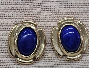 Handmade 14 carat gold stud earrings Lapis Lazuli stones set with oval cabochon Lapis Lazuli stones.   Dimension 0.7 cm X 0.5 cm approximately.