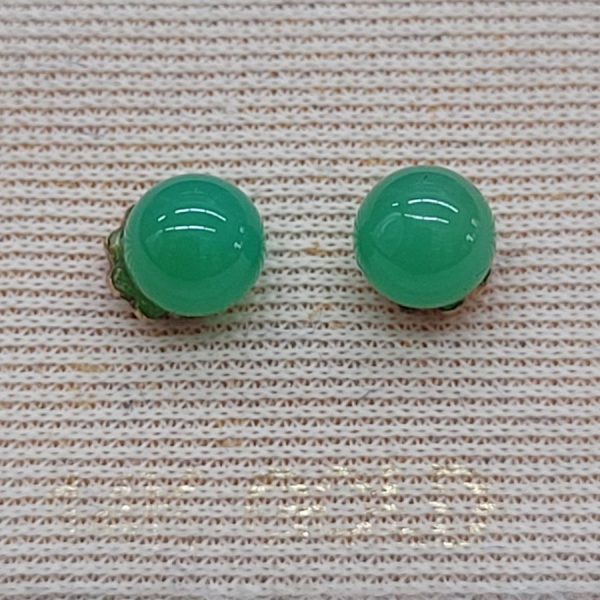 Handmade 14 carat gold stud earrings green Jade stones set in gold round cabochon disk holding stone.   Dimension diameter 0.5 cm approximately.