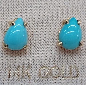 Handmade 14 carat gold stud earrings Turquoises stones cabochon drop shape set in 4 prongs setting. Dimension 0.7 cm X 0.5 cm approximately.