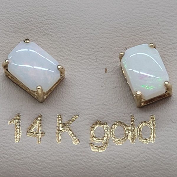 Handmade 14 carat gold cabochon Opal stud earrings set with two cabochon fire Opal stones handmade.   Dimension 0.5 cm X 0.7 cm approximately.