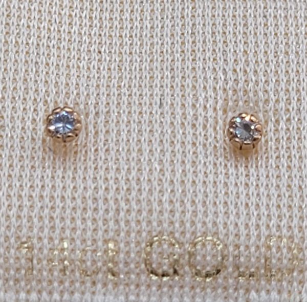 Handmade 14 carat gold stud earrings white Zircons stones faceted round shape set in 8 prongs setting. Dimension diameter 0.2 cm approximately.