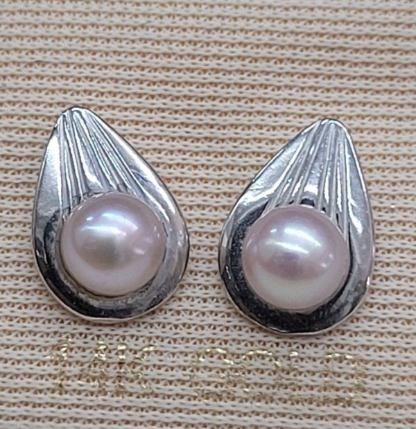 Handmade 14 carat white gold drop Pearls stud earrings with drop shape gold design holding the pearls.   Dimension 1.1 cm X 0.8  cm approximately.
