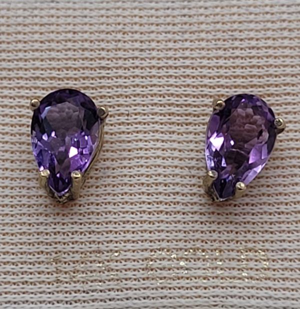 Handmade 14 carat gold stud earrings Amethyst faceted stones tear drop shape set in 4 prongs setting. Dimension 0.8 cm X 0.5 cm approximately.
