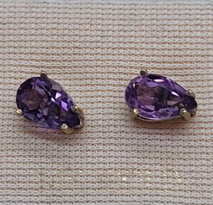 Handmade 14 carat gold stud earrings Amethyst faceted stones tear drop shape set in 4 prongs setting. Dimension 0.8 cm X 0.5 cm approximately.
