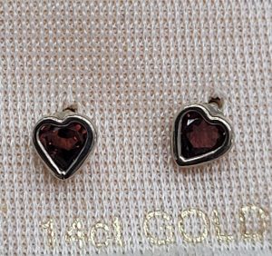 Handmade 14 carat white gold Garnets heart shape stud earrings set with two heart shape faceted Garnets stones handmade 0.5 cm X 0.5 cm approximately.