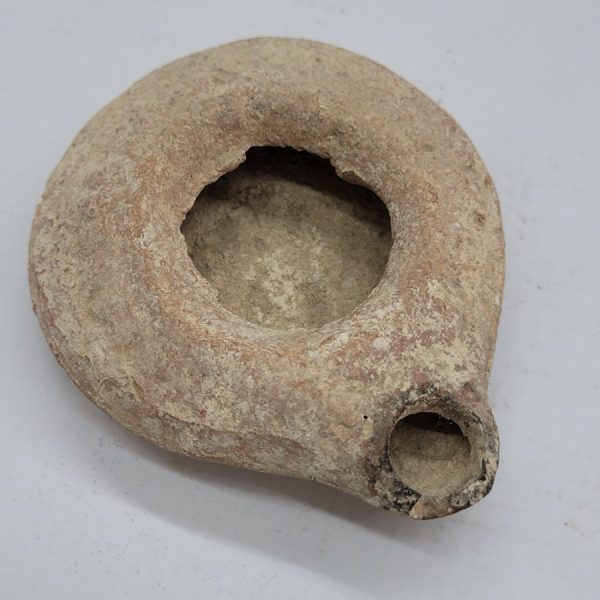Antique round Herodian oil lamp 1st century, early King Herod era found in the Holy Land of Israel 1st century CE. Dimension 8.5 cm X  7 cm X  2 cm.