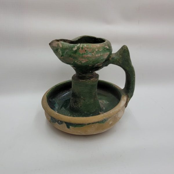 Genuine antique Islamic green glazed pottery lamp oil 10th century CE with green glazing and a massive handle. Dimension diameter 10 cm X 10 cm.