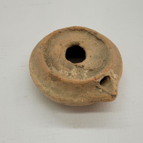 Genuine antique round Roman oil lamp early Roman  era. It is from private collection. Dimension 7.5 cm X 15 cm X  7 cm approximately.