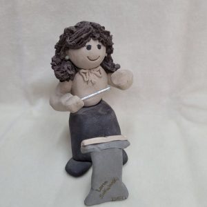 Handmade ceramic sculpture Maestro girl and music stand made in 1980's by Sakolovsky. There are more various characters in stock of Sakolovsky creations.