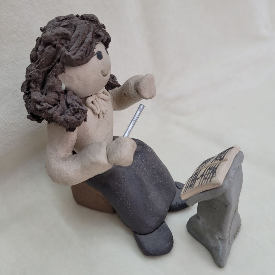 Handmade ceramic sculpture Maestro girl and music stand made in 1980's by Sakolovsky. There are more various characters in stock of Sakolovsky creations.