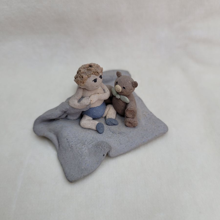 Handmade Kid's bear ceramic sculpture tiny boy with his bear buddy made in 1980's by Sakolovsky . Dimension 5.5 cm X 5.5 cm X 2.7 cm approximately.