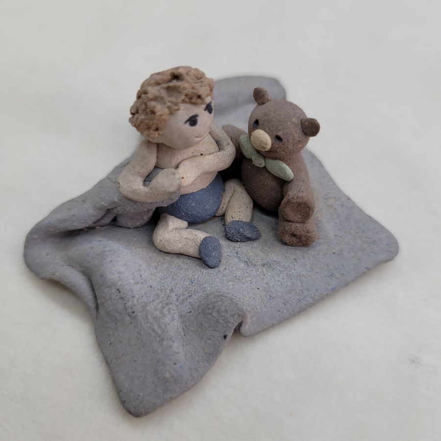 Handmade Kid's bear ceramic sculpture tiny boy with his bear buddy made in 1980's by Sakolovsky . Dimension 5.5 cm X 5.5 cm X 2.7 cm approximately.