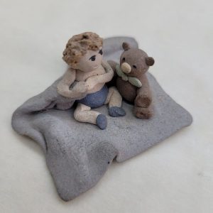 Handmade Kid's bear ceramic sculpture tiny boy with his bear buddy made in 1980's by Sakolovsky . Dimension 5.5 cm X 5.5 cm X 2.7 cm approximately.