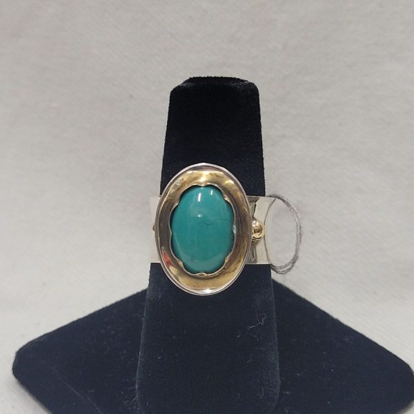 Handmade sterling silver and 14 carat yellow gold Oval cabochon Turquoise ring very modern and original design set with oval cabochon Turquoise stone.