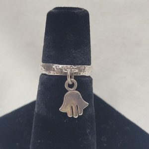 Handmade sterling silver hanging Hamsa hammered band ring  suitable for man finger. Dimension Hamsa 0.6 cm X 0.5 cm approximately.