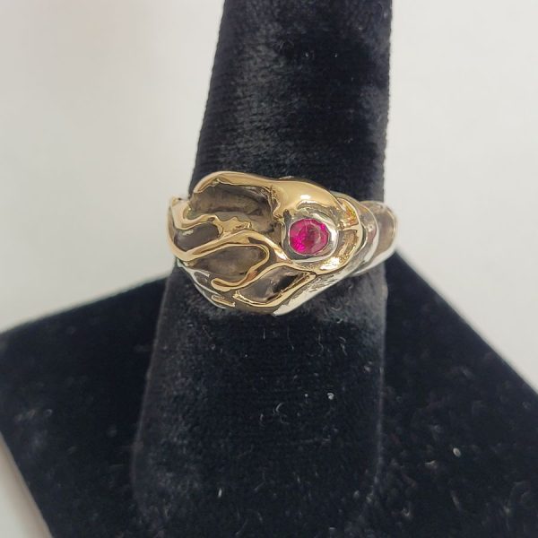 Original abstract genuine Ruby ring made with sterling silver and 14 carat gold and set with genuine red Ruby stone 1.5 cm X 1.2 cm approximately.