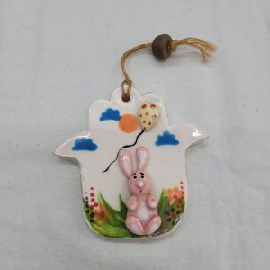 Pink bunny ceramic Hamsa glazed wall hanging handmade by Raheli with blue horse .Hamsa is considered in this era as an amulet to protect from the evil eye.