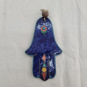 Nurit the artist has made this rich looking Chamsa blue Hamsa glazed ceramic from hard clay and has engraved on the back side Chai and Jacob's blessings.