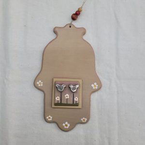 The artist has added to the hamsa Chamsa wood and metal two silver plated metal doves. Hamsa is considered as an amulet to protect from the evil eye.