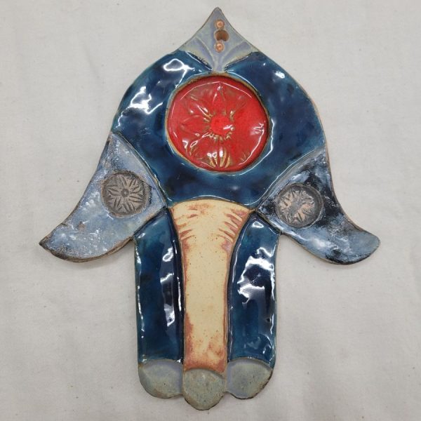 Handmade glazed ceramic tile Chamsa Hamsa up side down with flower in red round design. Dimension 18 cm X 21 cm approximately.