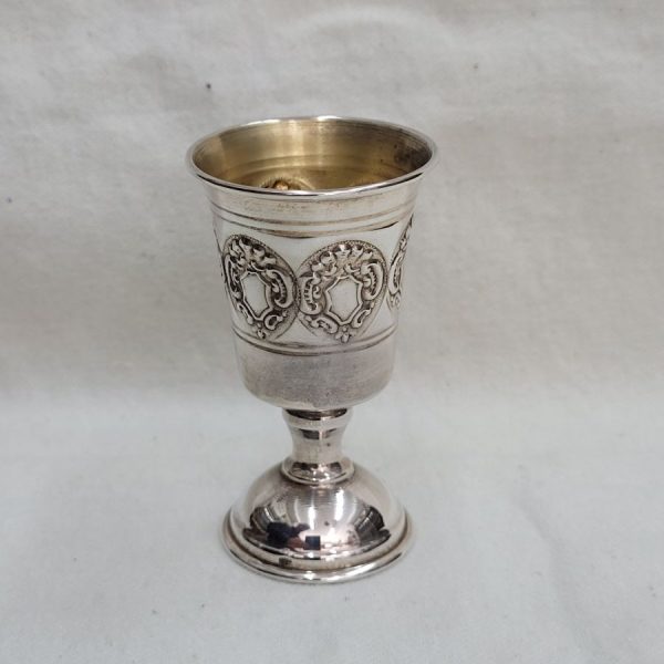 Handmade sterling silver Schnapps cup embossed design, with embossed designs all around cup. Dimension diameter 4  cm X 7 cm approximately.