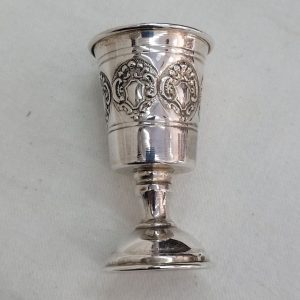 Handmade sterling silver Schnapps cup embossed design, with embossed designs all around cup. Dimension diameter 4  cm X 7 cm approximately.