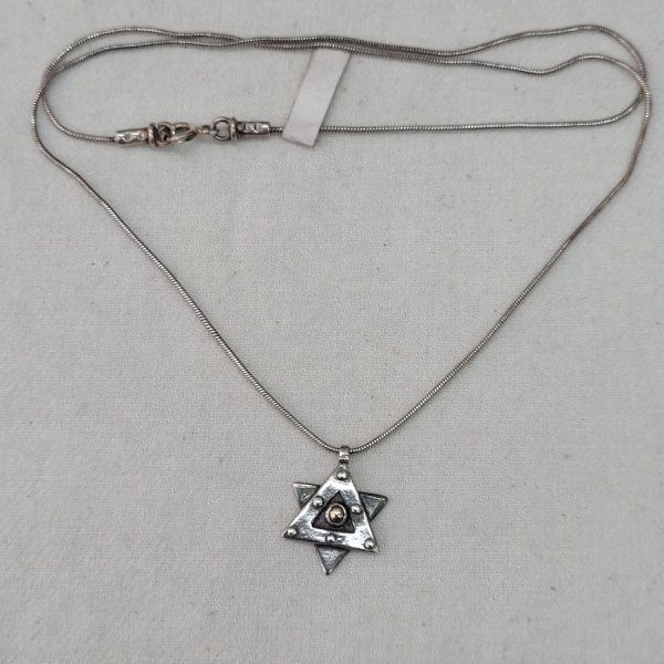 Handmade sterling silver pendant Magen David star, contemporary design oxidized and with snake chain. Dimension star 1.3 cm X  2 cm X 0.28 cm.